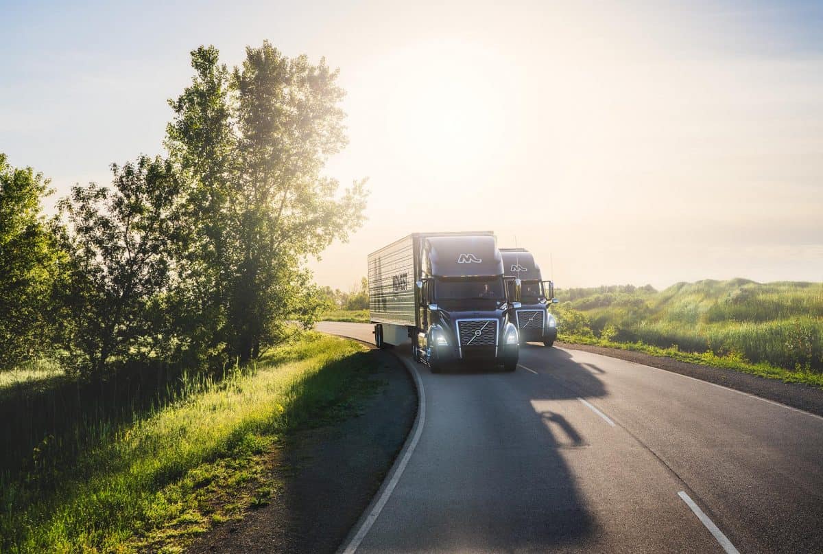 Trucks driving on sunny day