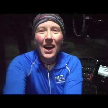 Female truck driver sitting in truck cab talking about driver perks